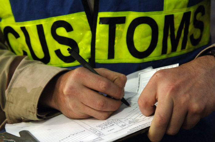 Customs signing paperwork