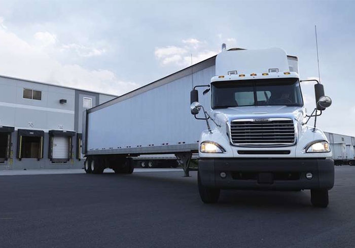 Truck departing from warehouse