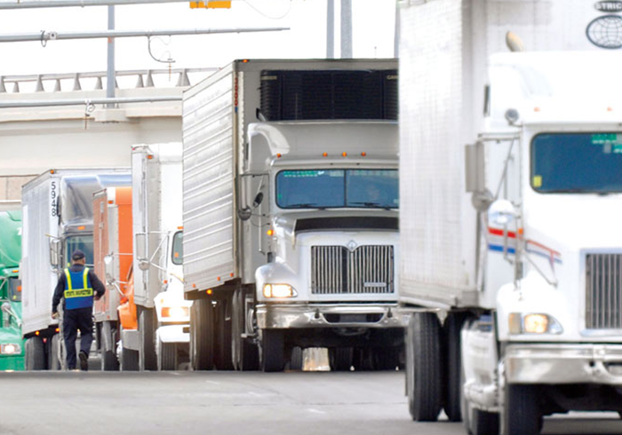 Large line of trucks passing though customs