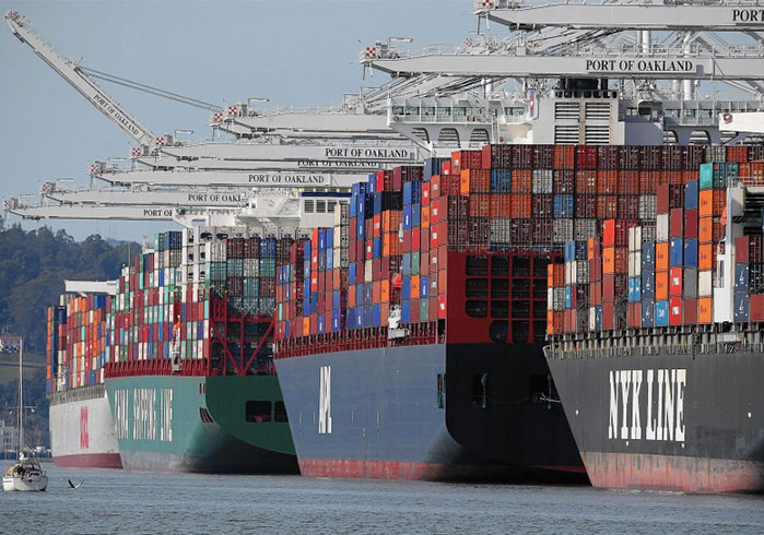 Line of freight ships waiting at port