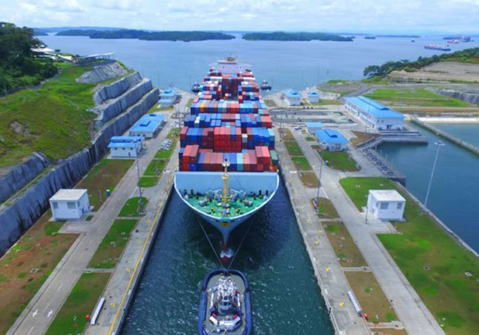 Freight ship passing through the panama canal
